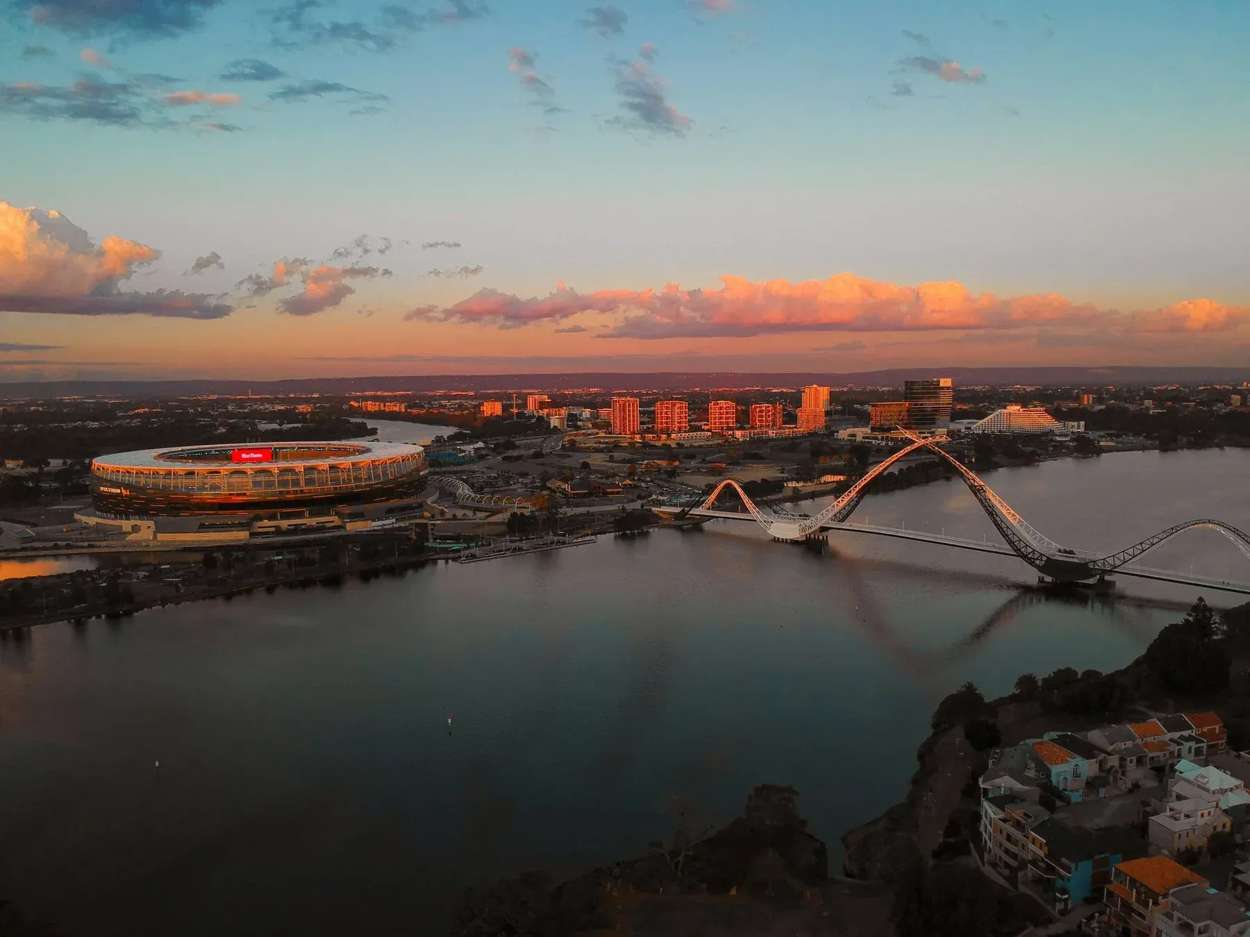 Aerial view of the Swan River and the Perth skyline at sunset